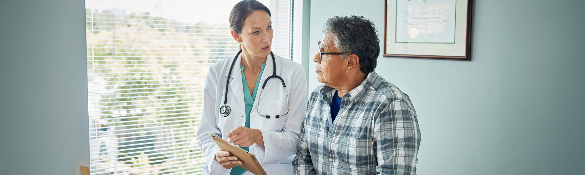 Doctor speaks with male patient