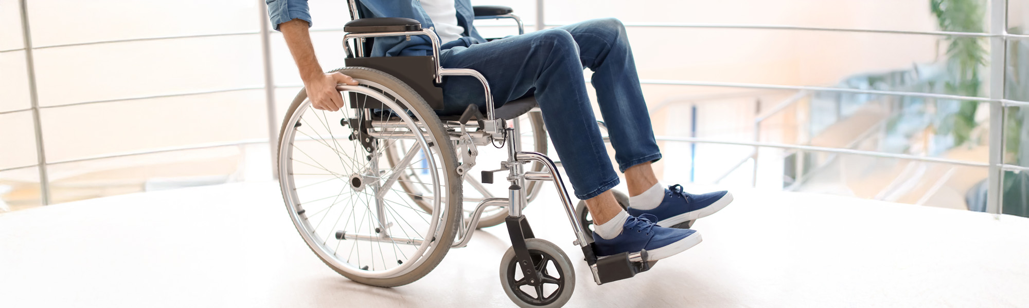Man sitting in wheelchair indoors