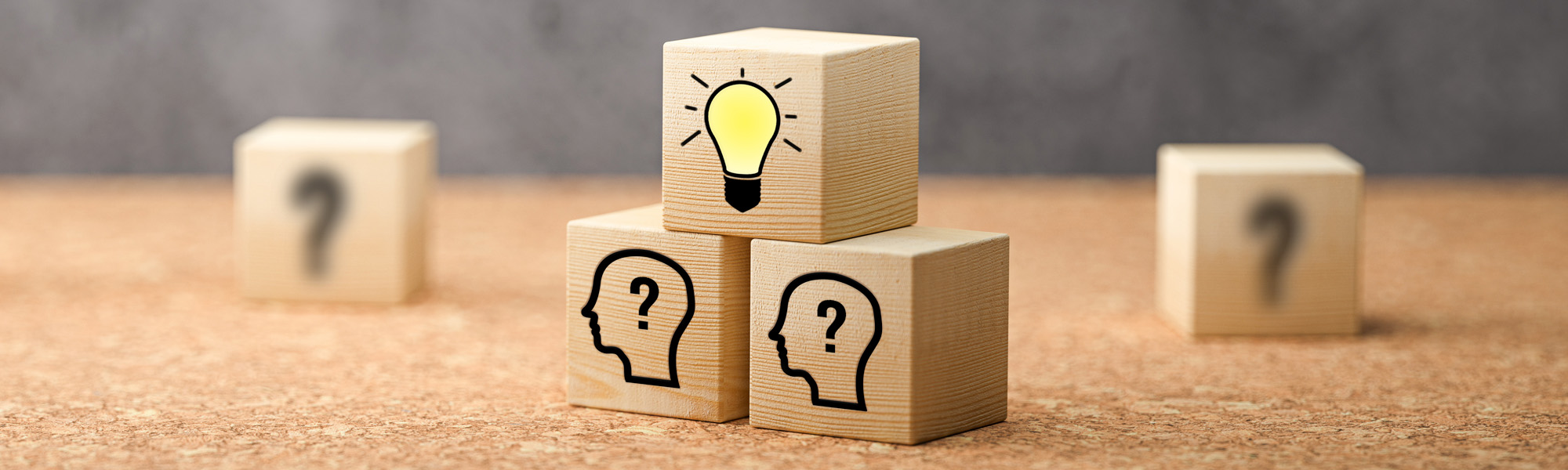 cubes showing a brainstorming session on concrete background