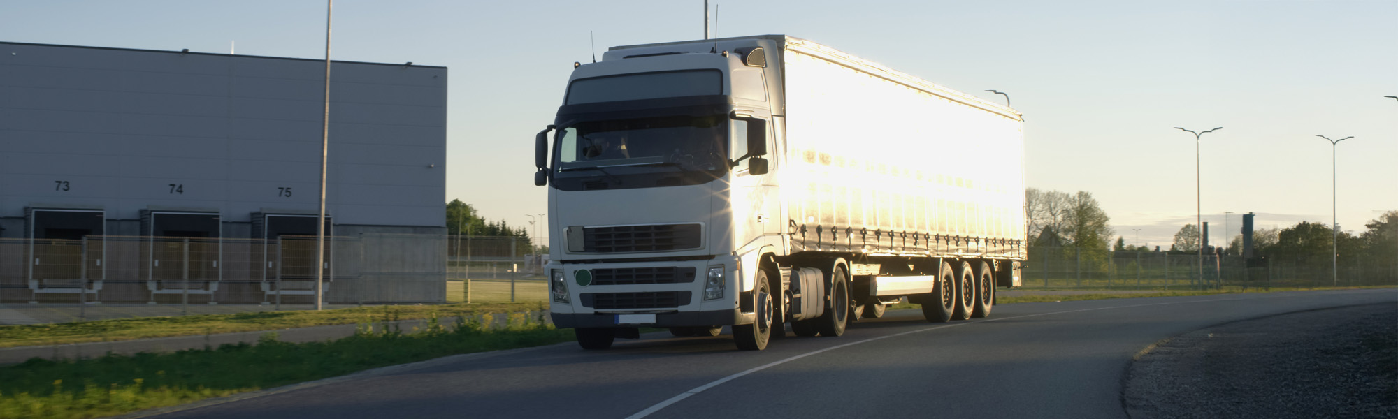 emi Truck with Cargo Trailer Moving on a Highway