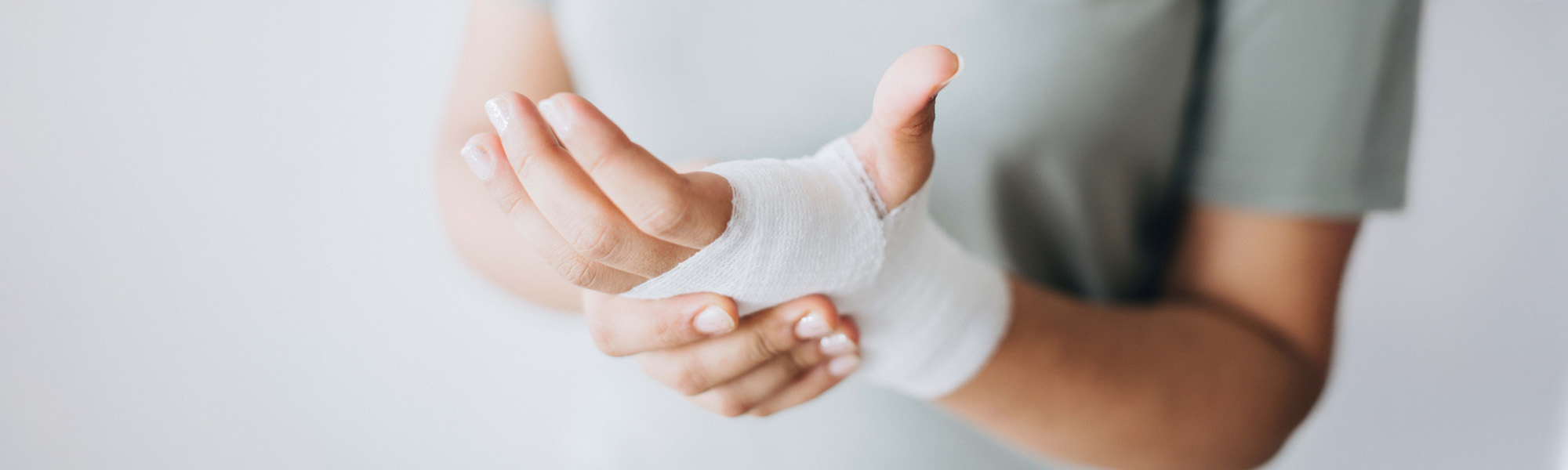 woman with gauze bandage wrapped around her hand