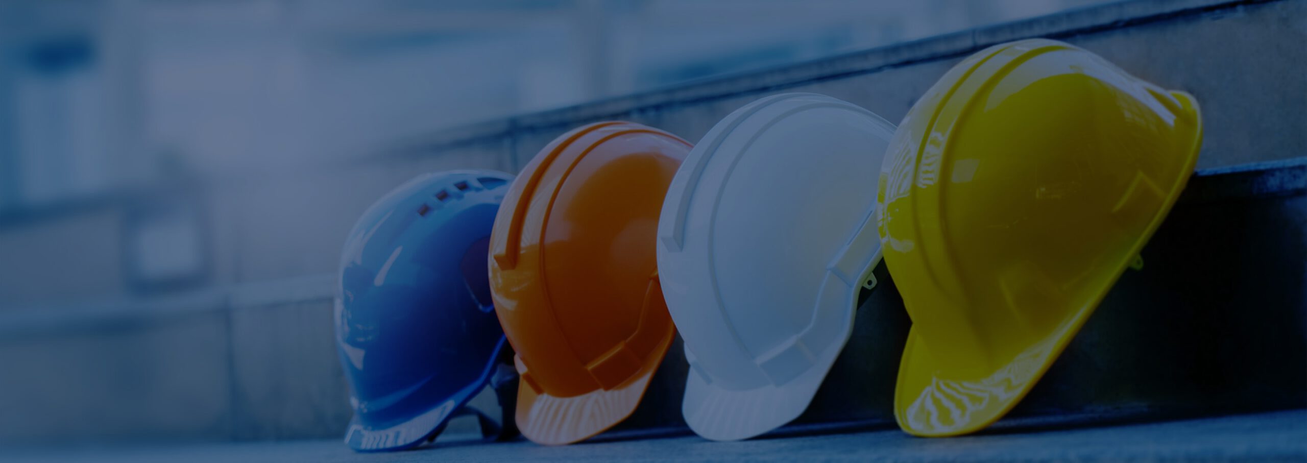 Photo of workers' hard hats in a row