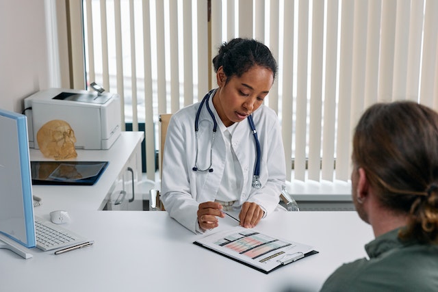 doctor speaking with patient
