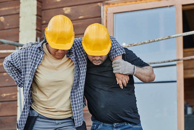 employee helping injured co-worker