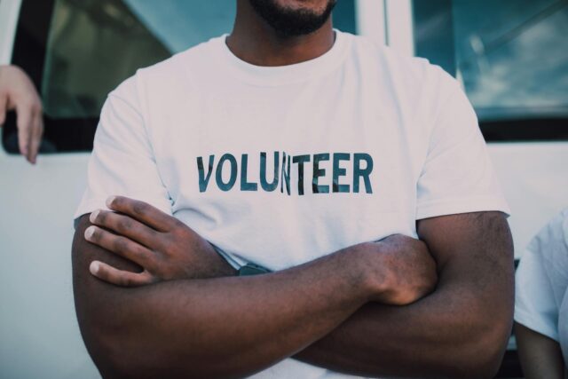 man in volunteer shirt