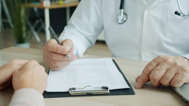 doctor writing note